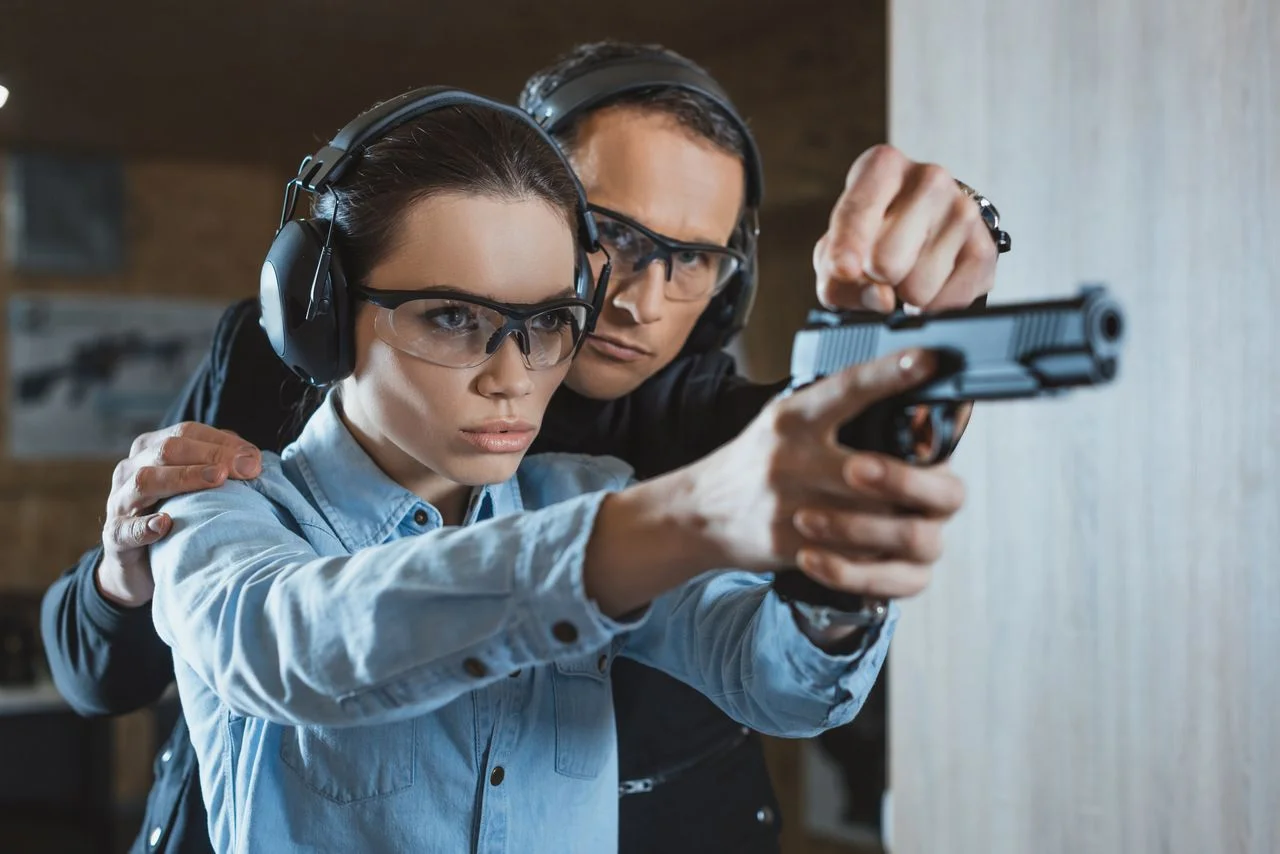 Instructor helping customer in shooting