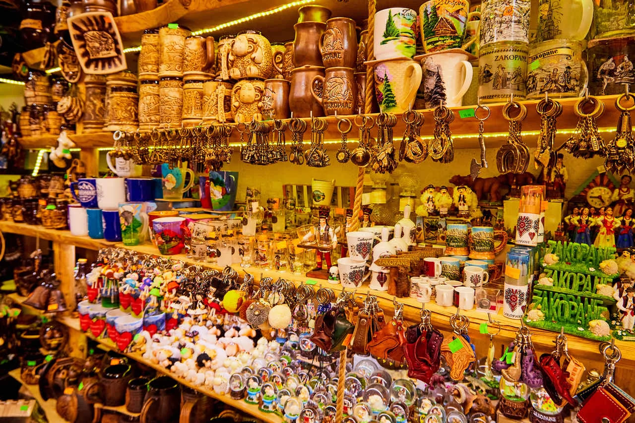 Many funny interesting european souvenirs inside of tourist market, Zakopane, Poland
