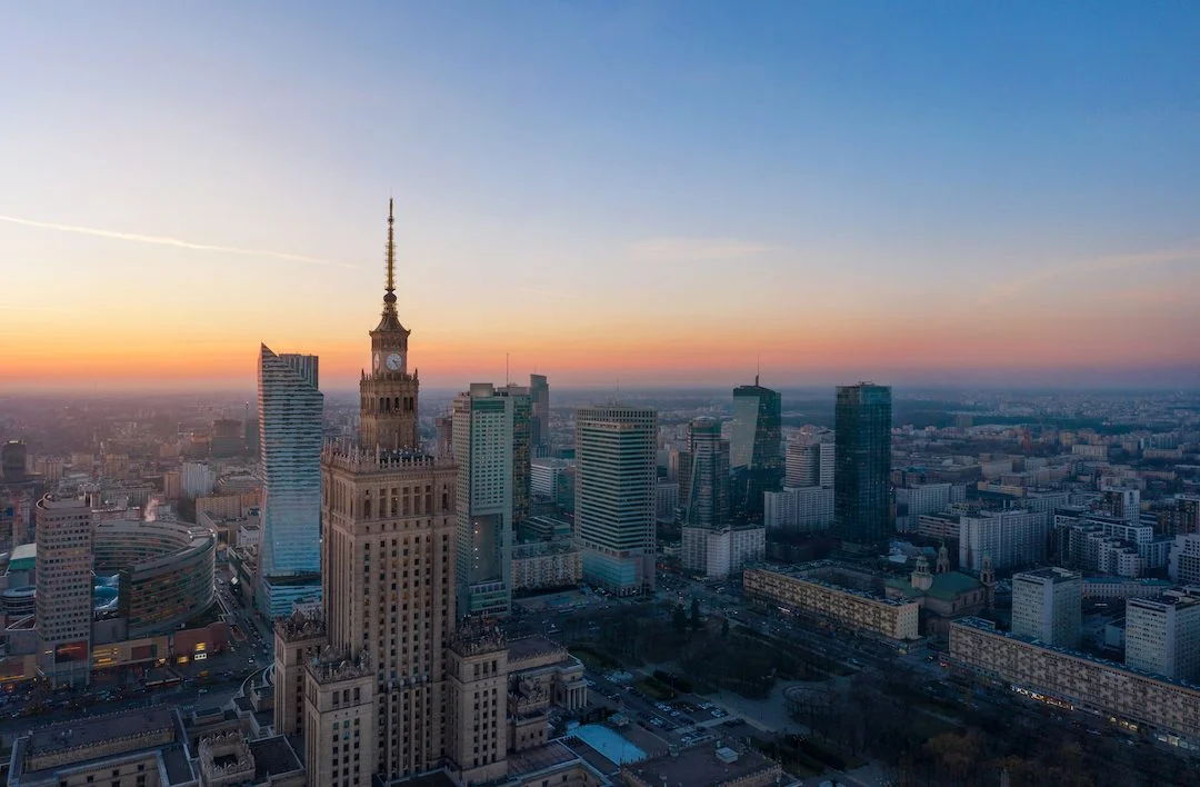 Aerial view of the business center of Warsaw: Palace of Science and Culture and skyscrapers in the evening