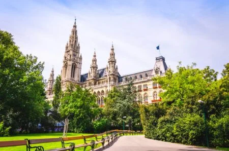 Facade of Vienna City Hall building, view from picturesque green park