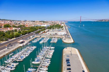 Docks on the banks of River Tagus, with the bridge and Lisbon