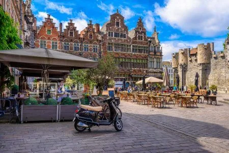 Old square with tables of cafe in Ghent (Gent), Belgium