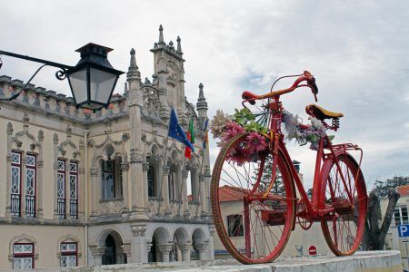 Old style bright red bicycle on display, Sintra
