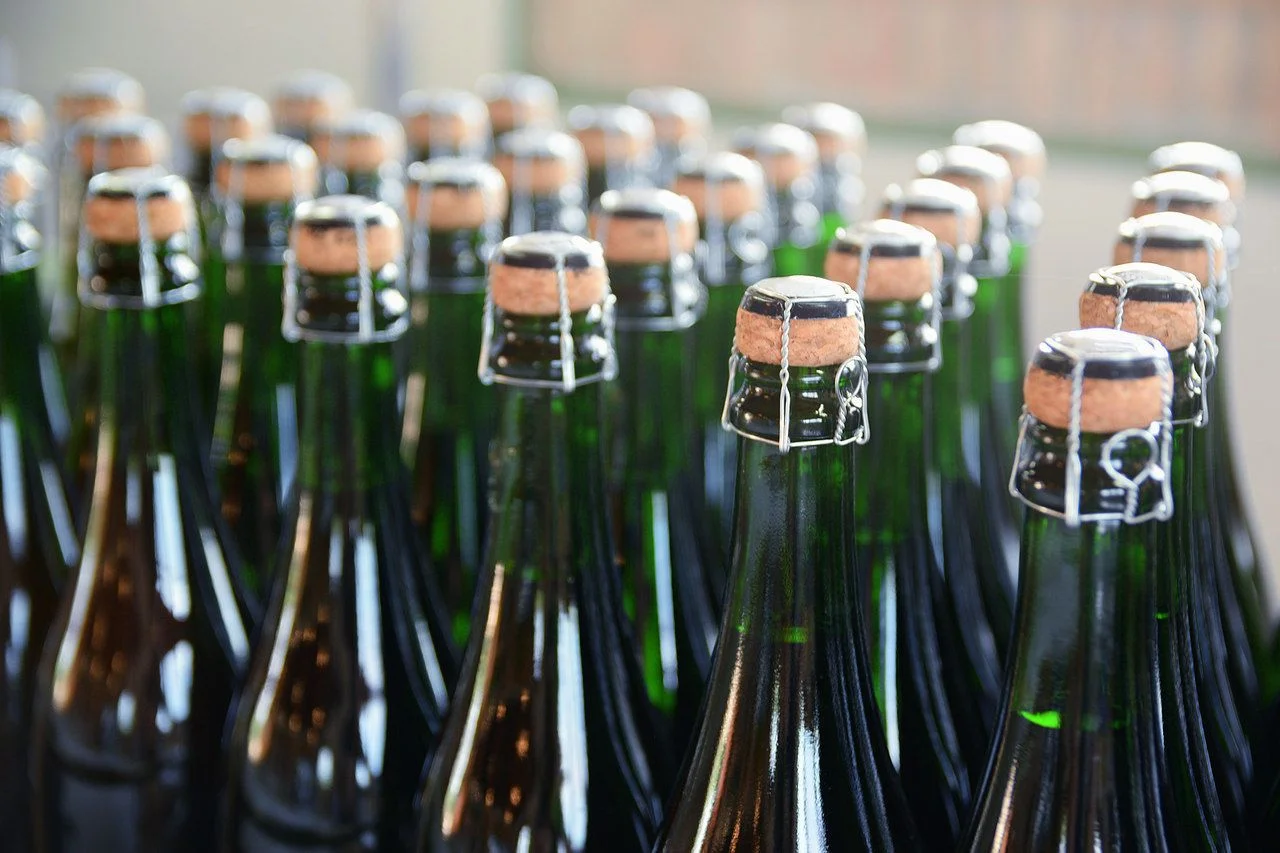 Some green champagne bottles