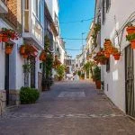 A typical street in old city Estepona with colorful flower pots
