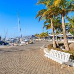 Bench on coastal promenade in Puerto Calero marina, Lanzarote
