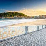 Nice beach with the old town of San Sebastian, Spain in the morning