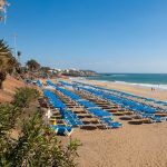 Puerto del Carmen promenade, view of the sunbeds on the beach, Lanzarote