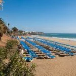 Puerto del Carmen promenade, view of the sunbeds on the beach, Lanzarote