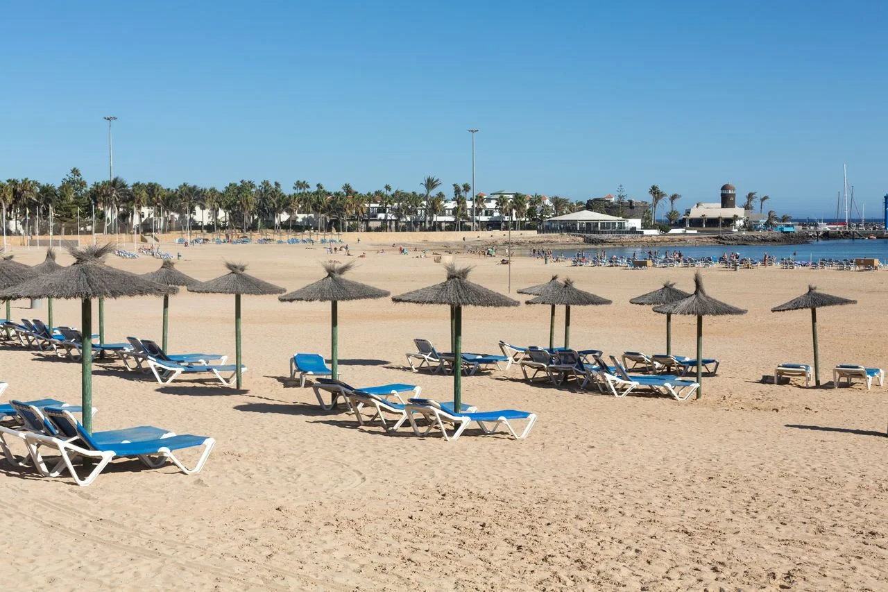 Sun lounger on the beach of Caleta de Fuste, Canary Island Fuerteventura, Spain