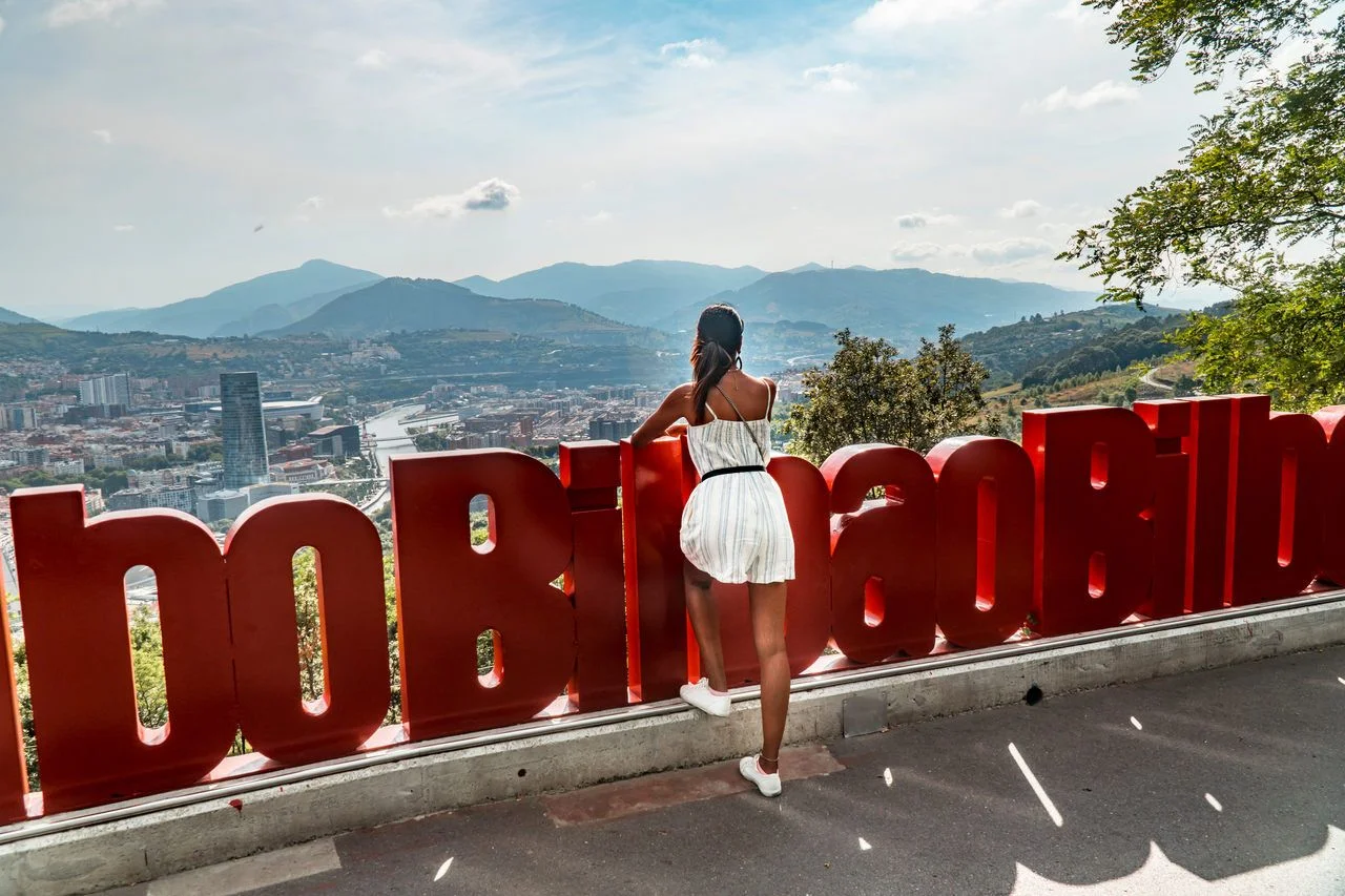 Tourist woman & Red Bilbao Sign