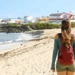 Young female backpacker hiking in Corralejo, Fuerteventura Island