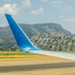 Aerial shooting from an airplane flying over the ground mountains in Dalaman Airport Turkey Mugla