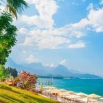 Beautiful beach with green trees in Kemer, Turkey. Summer landscape, travel and vacation