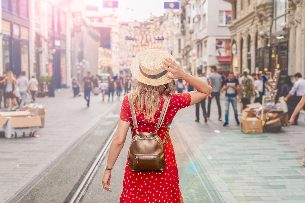 Beautiful woman stands at Istiklal street,a popular location in Beyoglu district,Istanbul,Turkey