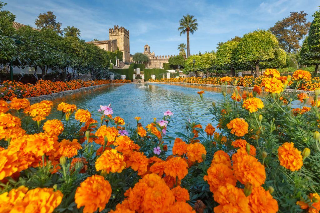 Blooming gardens and fountains of Alcazar de los Reyes Cristianos, royal palace of the cristian kings, in Cordoba