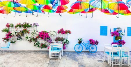 Charming street (outdoor) decoration with old bicycle , flowers and umbrellas, Bodrum,Turkey