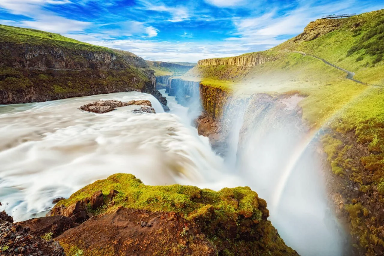 Iceland, Gullfoss waterfall. Captivating scene with rainbow of Gullfoss waterfall that is most powerful waterfall in Iceland and Europe. Picturesque summer scene with amazing Icelandic waterfall.