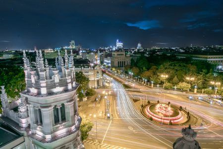 Madrid skyline between Calle de Alcalá y Gran Vía and Cibeles Fountain and Palace at night. Long Exposure of all landmark of Madrid