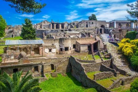 Panoramic view of the ancient city of Pompeii with houses and streets.