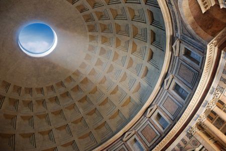 Roman Pantheon with blue sky and sun reflection from cupola hole