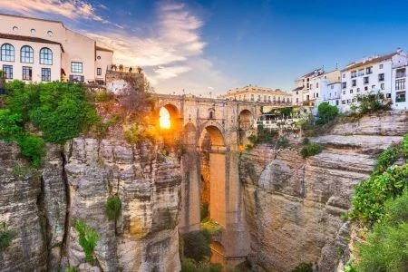 Ronda, Spain at Puente Nuevo Bridge at sunset.