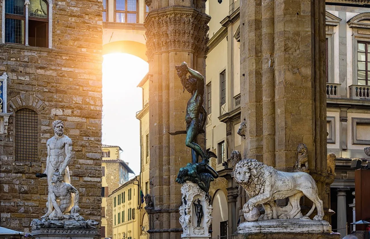 Sculpture of Loggia dei Lanzi and Florence Palazzo Vecchio on Piazza della Signoria in Florence, Italy. Architecture and landmark of Florence