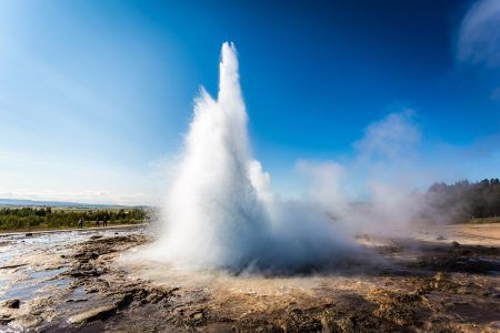 Stokkur geyser eruption, Iceland. Blue sky in a sunny day