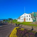 Street scene street in downtown Reykjavik, Iceland, leading to the Hallgrimskirkja Church, one of the landmarks of the city