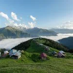 Traditional wooden houses at highlands. Landscape photo was taken in Pokut, Rize, Black Sea Karadeniz region of Turkey. Pokut is one of Rize’s highest altitude summer resorts.