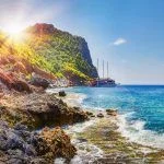 Tropical rocky beach on sunny summer day in Alanya, Turkey.