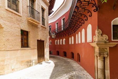 Typical narrow street with cobblestone stairs and colorful houses in old town. Toledo, Castilla La Mancha, Spain, Western Europe.