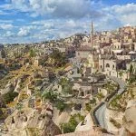 View of ancient Nevsehir cave town and a castle of Uchisar dug from a mountains in Cappadocia, Central Anatolia,Turkey