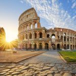 View of the Colosseum in Rome and the morning sun, Italy, Europe