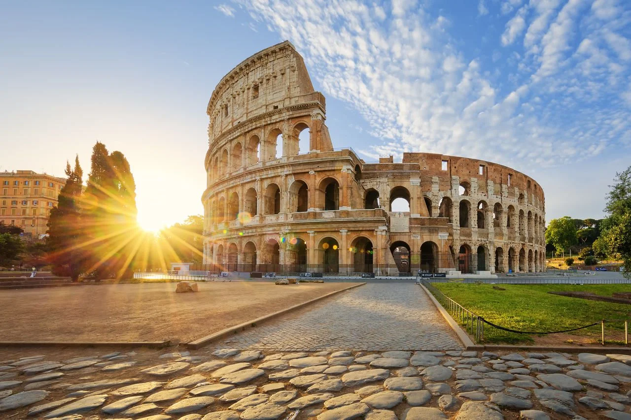 View of the Colosseum in Rome and the morning sun, Italy, Europe