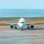 White passenger airplane taxiing on airport apron in the background amazin black sea – Trabzon