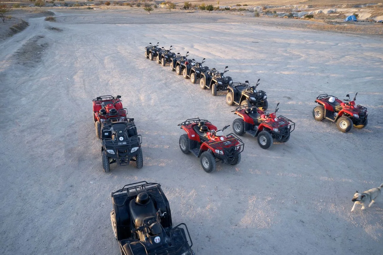 Atv quad bikes on a dust off road. Quad biking safari. Extreme adventures concept. Safari and exotic travel. Cappadocia, Turkey.