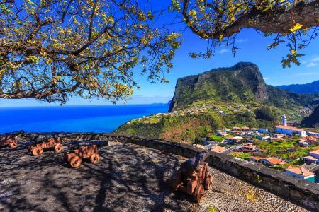 Cityscape over Faial region and historical fortress and antique gun cannons in Madeira island, Portugal