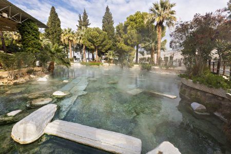 Historic thermal pool with Roman ruins in Pamukkale, Turkey.