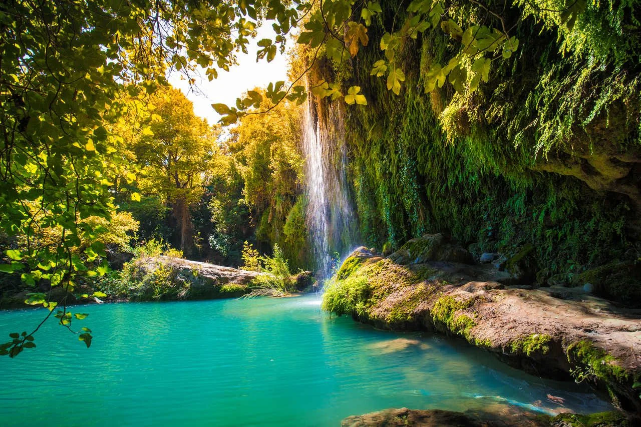 Majestic waterfall with a green pool. Waterfall view in sunny day. Kursunlu waterfalls, Antalya, Turkey