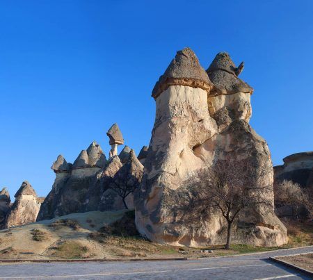 Pasabag valley in Cappadocia, Central Anatolia, Turkey. Pasabag valley (Valley of the monks) contains some of the most striking fairy chimneys in Cappadocia with twin and even triple rock caps.