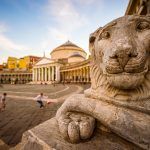 Scenic view of the Basilica Reale Pontificia San Francesco di Paola (built in 1816) dominated by the grand lionesses guarding the Piazza del Plebiscito in Naples, Italy