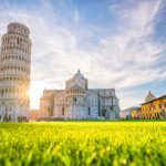 The Leaning Tower of Pisa, campanile, or freestanding bell tower, of the cathedral of the Italian city of Pisa. Blue sky.