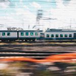 Train in motion on the railway station. Train with motion blur effect on the railway platform. Industrial. Railroad in Europe.