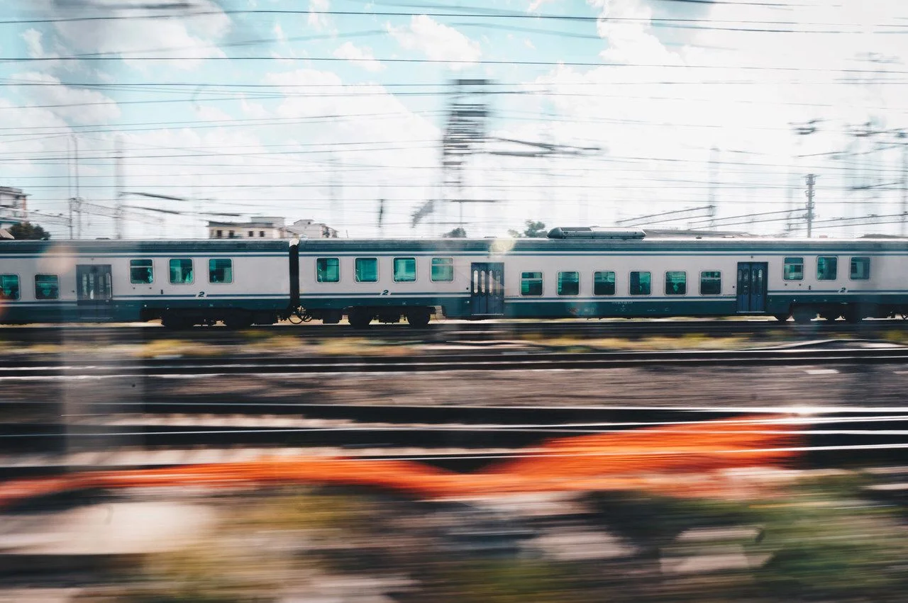 Train in motion on the railway station. Train with motion blur effect on the railway platform. Industrial. Railroad in Europe.