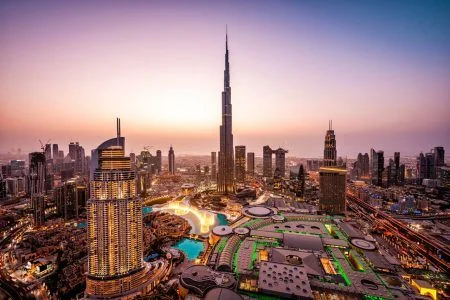 WOW view of Dubai skyline at night. The city lights are on. Dancing fountain. Luxury travel vacation concept.