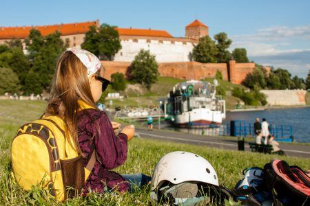 Cute little girl having a rest outdoors, Krakow in Poland.