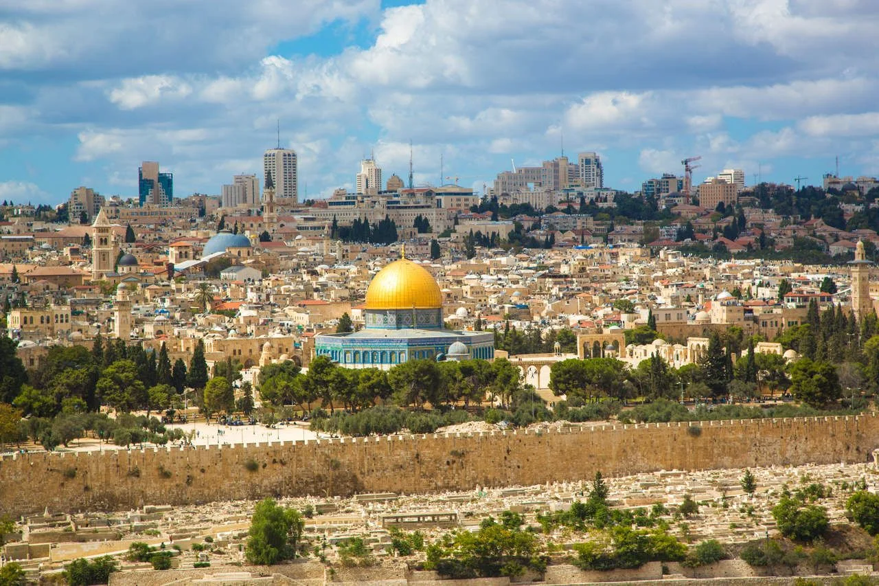 Jerusalem of Gold under cloudy sky – old town view from Mount of Olives