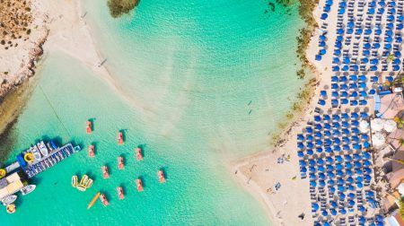 Nissi Beach in Ayia Napa, clear aerial photo of Cyprus famous tourist beach, the place is a famous island destination and is formed from a smaller island just off the main shore