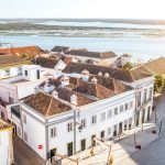 Top cityscape view on the old town with beautiful rooftops in Faro on the south of Portugal
